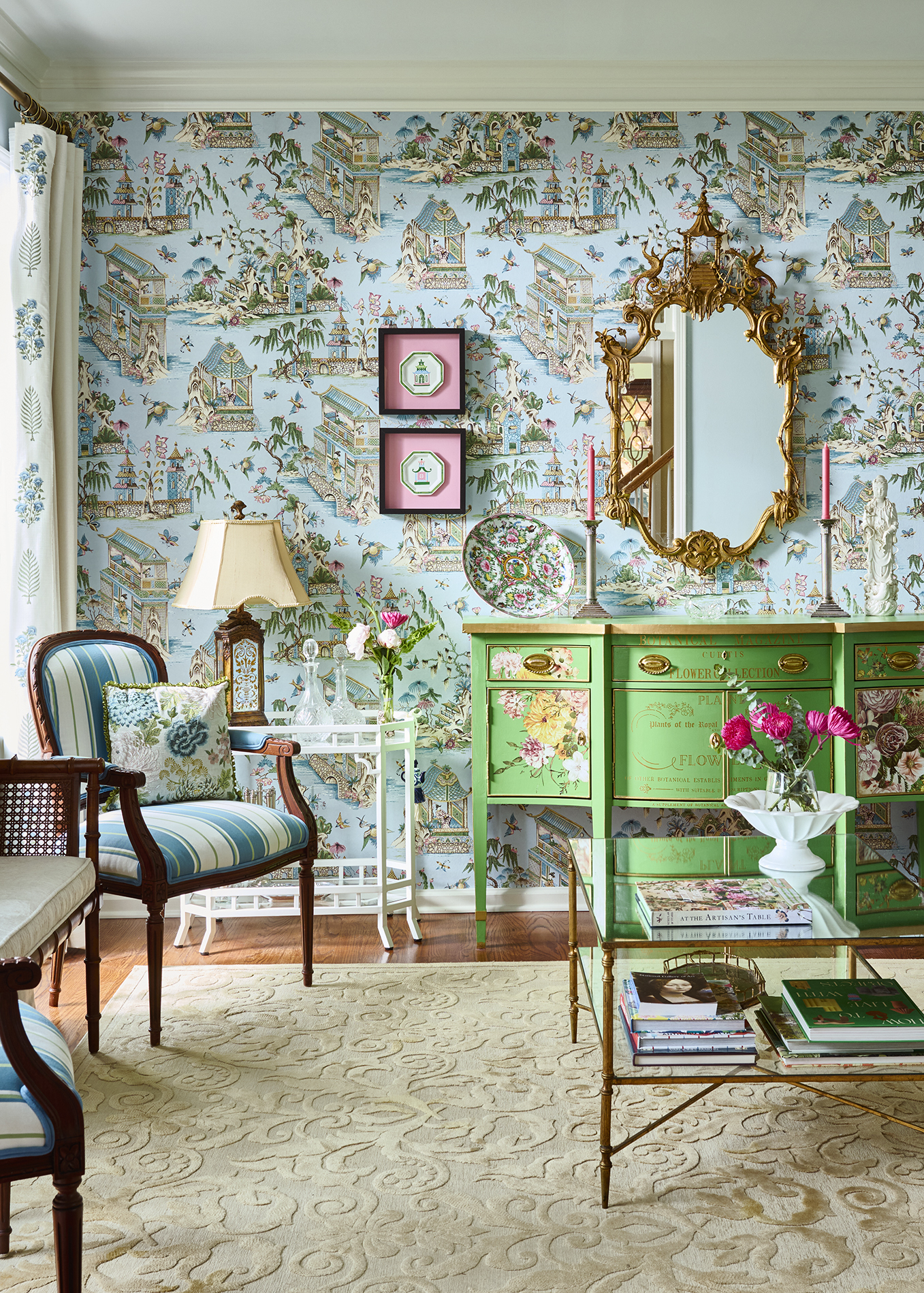 Chinoiserie living room with green sideboard and collected accents