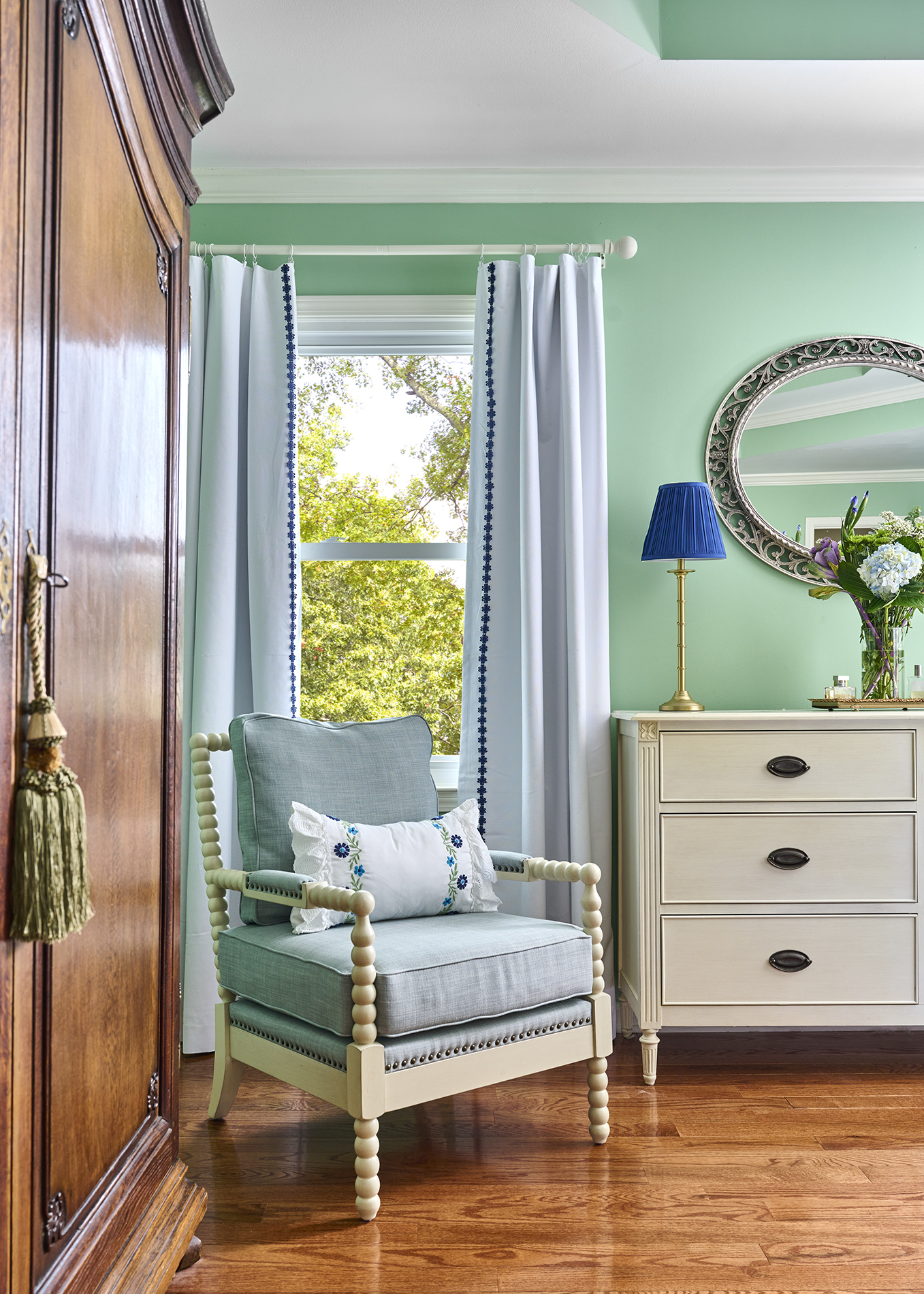 Primary Suite — Spool chair & blue accents